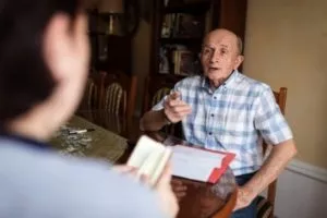 A victim of a nursing home negligence talking to an attorney.