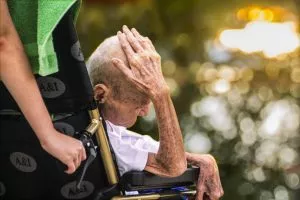 An elderly man in distress because of nursing home abuse in Charleston, WV.