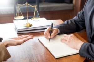 A client and an attorney discussing about a wrongful death case in Charleston, WV.